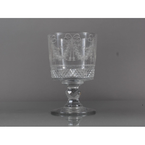 70 - An early 19th century cut and wheel engraved goblet with swags and monogram SB, 5.8