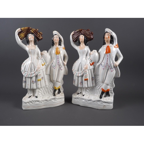 19 - A pair of 19th century Staffordshire figure groups, 13