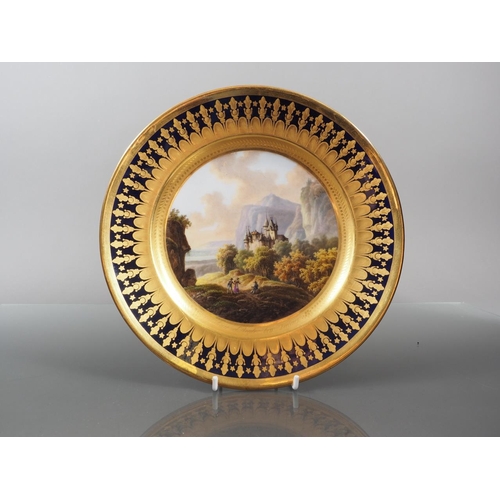 27 - An early 19th century Brussels porcelain dessert plate, decorated with landscape panel 