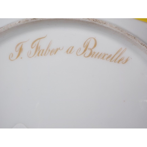 27 - An early 19th century Brussels porcelain dessert plate, decorated with landscape panel 