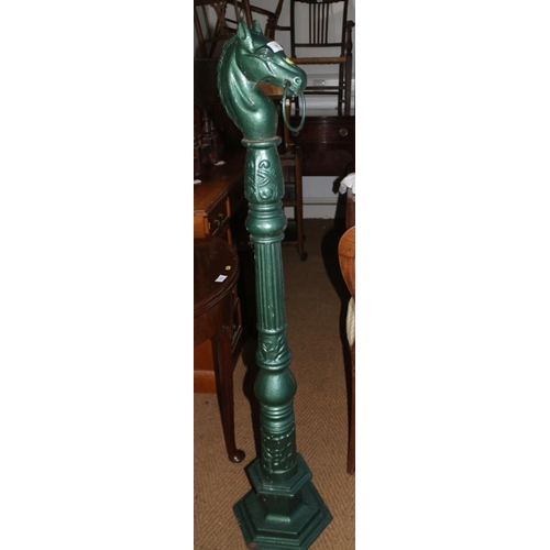 780 - A cast iron green-painted horse hitching post with fluted central column, on hexagonal base, 52 1/2