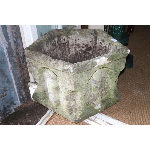 784 - A cast stone five-sided planter, in the form of a Norman font, 18