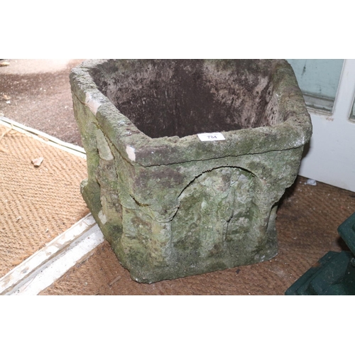 784 - A cast stone five-sided planter, in the form of a Norman font, 18