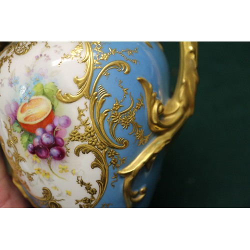 34 - An early 20th century Royal Worcester two-handle vase and cover with fruit decorated panel on a blue... 