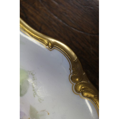 45 - A Royal Doulton shaped and scrolled gilt edged plate with white and purple bell flower decoration, s... 