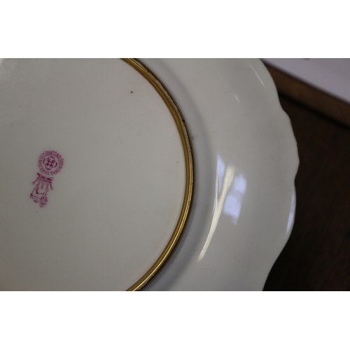 45 - A Royal Doulton shaped and scrolled gilt edged plate with white and purple bell flower decoration, s... 