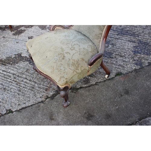 463 - A 19th century carved mahogany showframe low seat chair, on cabriole castored supports