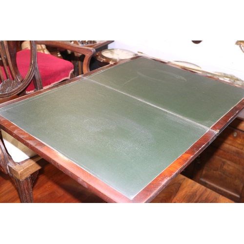 472 - An early 19th century rosewood fold-over top work table with faux leather interior, on turned column... 