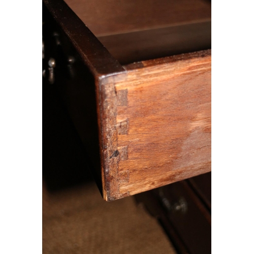 557 - A mahogany double pedestal desk with red leather top (top repair), fitted nine drawers, on bracket f... 