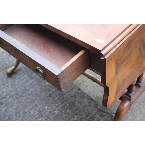 564 - A figured walnut and banded sofa table, fitted two drawers, on twin turned end and splay supports, 5... 