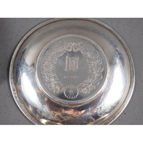 262 - Five Chinese silver and other white metal coin dishes set with coins and trade dollars, various, 8.5... 