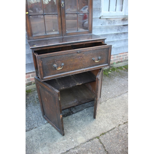 442 - A late 19th century oak secretaire bookcase, the upper section enclosed lattice glazed doors, over f... 