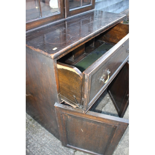 442 - A late 19th century oak secretaire bookcase, the upper section enclosed lattice glazed doors, over f... 