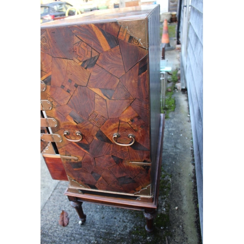 447 - A late 19th century Japanese parquetry cabinet, the interior fitted three small, three medium and tw... 