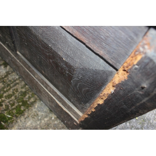 451 - An 18th century oak mule chest with later carved decoration, on stile supports, 42 1/2