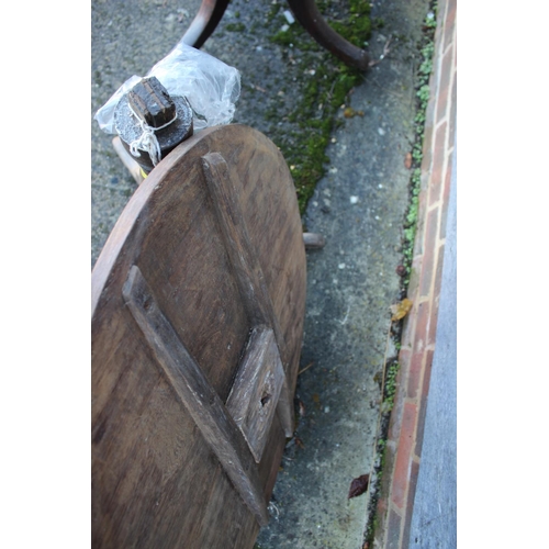 460 - A 19th century provincial oak tilt top table, on turned column and tripod splay support, 32