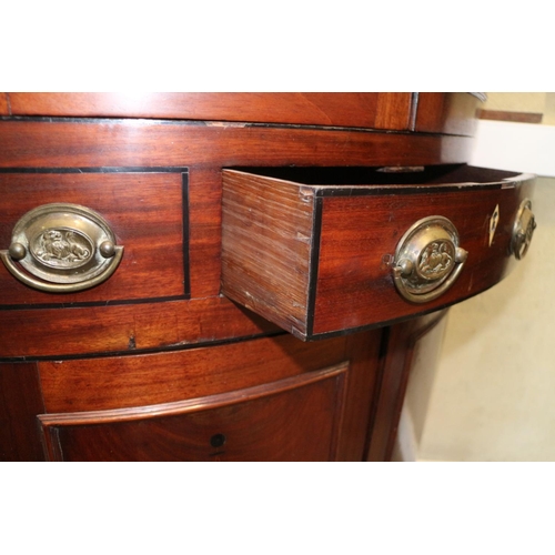 469 - A late Georgian mahogany and inlaid bowfront corner cupboard, the upper section fitted shelves and e... 