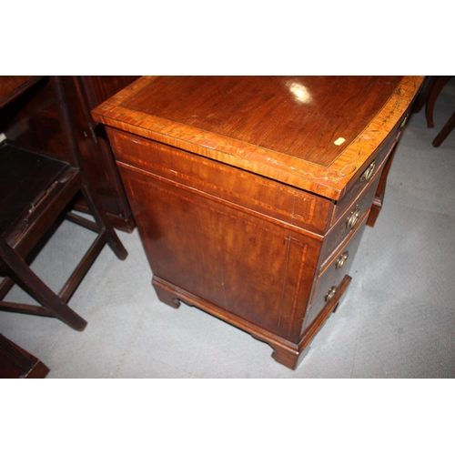 486 - A Sheraton Revival mahogany, satinwood banded and painted bowfront kneehole desk, fitted eight drawe... 