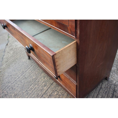 497 - An early 19th century mahogany banded and ebony strung secretaire chest, the writing compartment wit... 