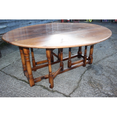 523 - An oak wake table with double gate leg supports, 66