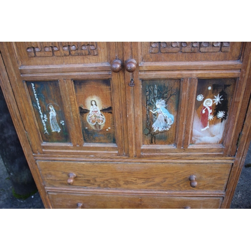 533 - A carved and painted oak linen press enclosed two doors over two drawers, on bracket feet, 33 1/2