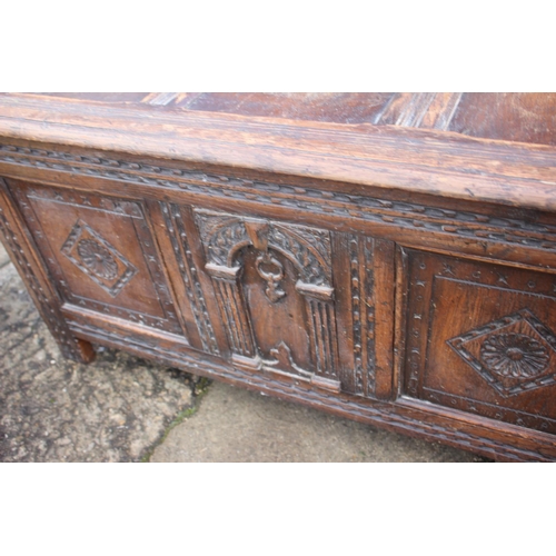 539 - A panelled oak coffer of 17th century design with arcaded and panelled front, 41