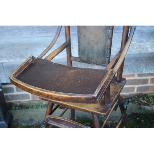 547 - A child's early 20th century metamorphic high chair/table with padded back