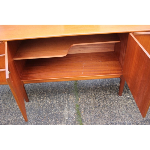 577 - An A H McIntosh & Co Ltd 1970s teak sideboard, fitted three drawers, two cupboards and drop-down... 