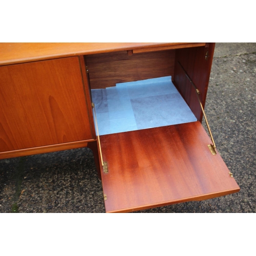 577 - An A H McIntosh & Co Ltd 1970s teak sideboard, fitted three drawers, two cupboards and drop-down... 