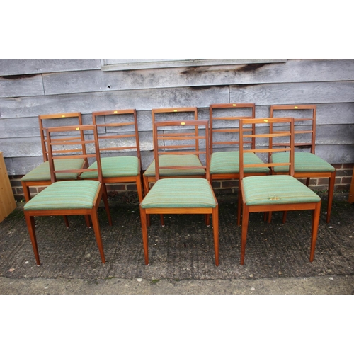 578 - An A H McIntosh & Co Ltd 1970s teak extending dining table with two extra integral leaves, 63