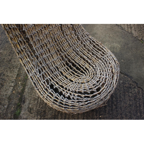 586 - A cane, grass string and woven bamboo tub chair