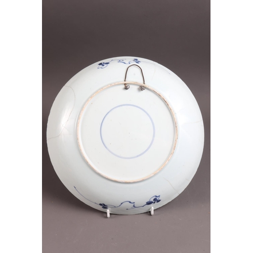 98 - A Chinese blue and white dish with panelled floral decoration and double mark ring to base, 11 1/4