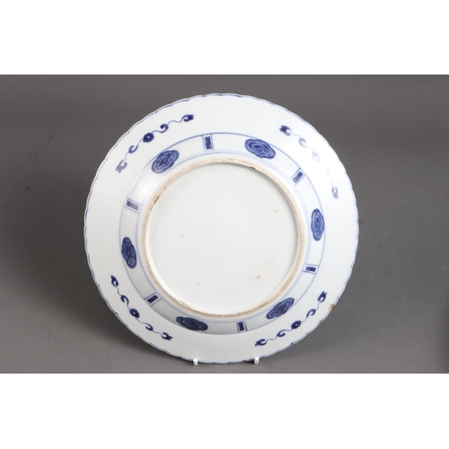 98 - A Chinese blue and white dish with panelled floral decoration and double mark ring to base, 11 1/4