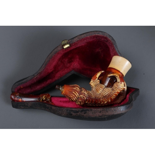 223 - A carved Meerschaum pipe, formed as a nymph playing a harp, in case, two other pipes, a resin figure... 