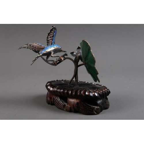 285 - A Chinese silver filigree and enamelled model of a kingfisher with lotus leaf and blossoms, on hardw... 