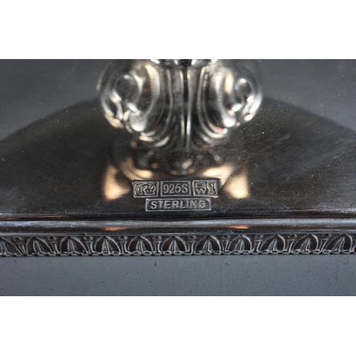 290 - A silver oval shaped two-handled pedestal dish with embossed column, on square stand with filled bas... 