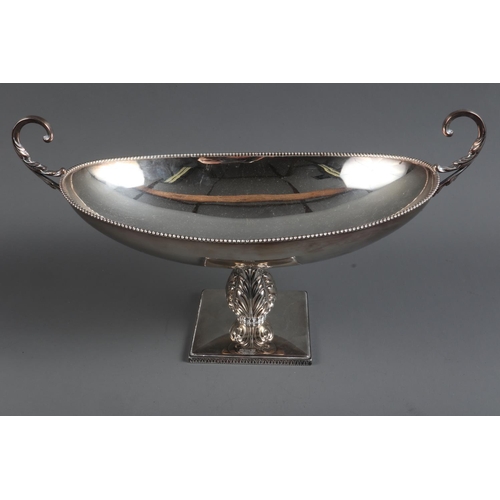 290 - A silver oval shaped two-handled pedestal dish with embossed column, on square stand with filled bas... 