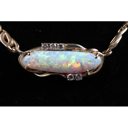 319 - A 18ct gold double curb style chain with shaped opal and diamond set pendant, 21 1/4