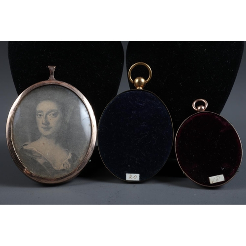 404 - Two early 18th century monochrome portrait miniatures, lady and gentleman, in gilt metal frames, and... 