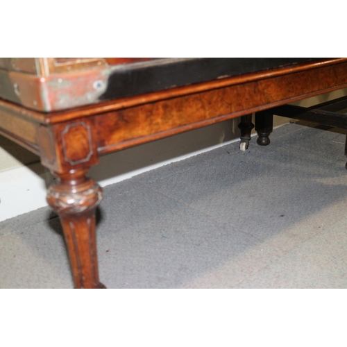 448 - A 19th century walnut low stool, on carved and turned castored supports, 38