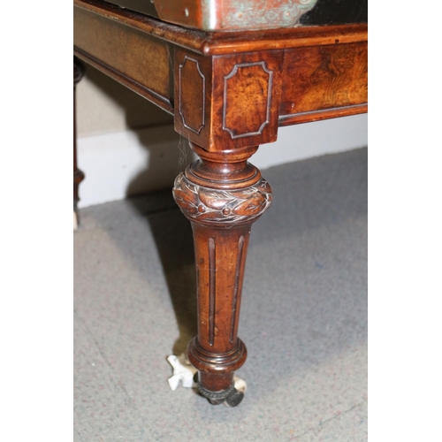 448 - A 19th century walnut low stool, on carved and turned castored supports, 38