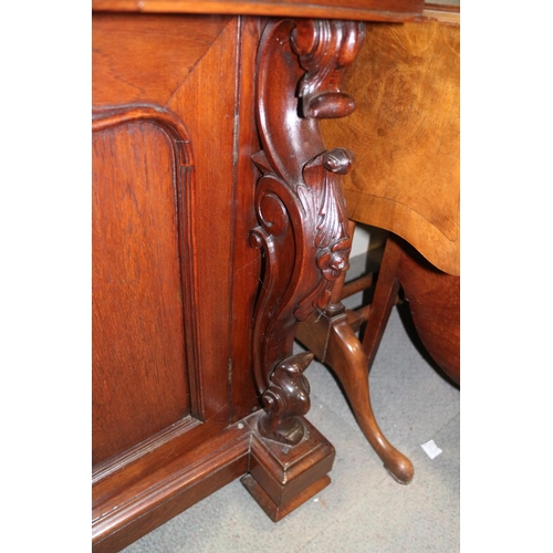 482 - A 19th century Continental carved mahogany bookcase, the upper section enclosed two arch top glazed ... 