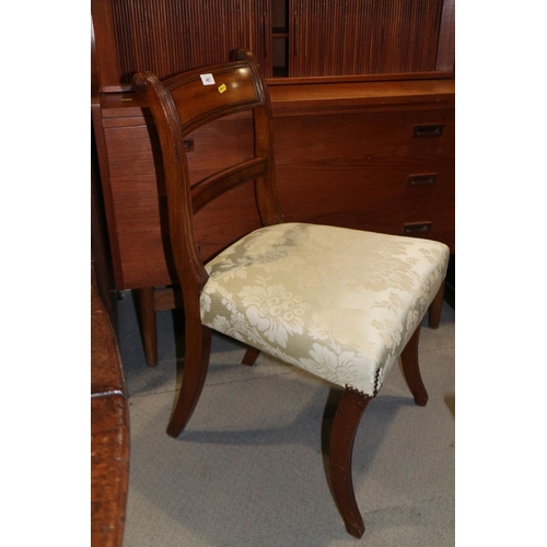 487 - A pair of early 19th century mahogany bar back chairs, upholstered in a cream brocade, on sabre leg ... 