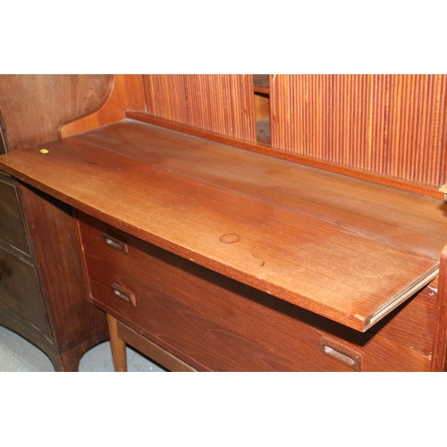 520 - A 1970s Heals teak bureau bookcase, the upper section with shelves over fitted compartment with tamb... 