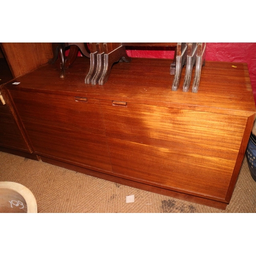 530 - A 1960s Danish teak display cabinet enclosed two doors over six graduated drawers, on block base, an... 