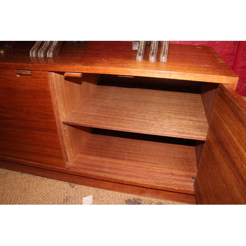 530 - A 1960s Danish teak display cabinet enclosed two doors over six graduated drawers, on block base, an... 