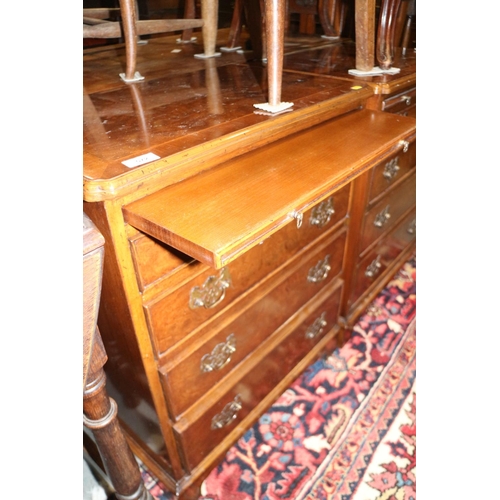 572 - A pair of bachelors' walnut and banded chests of four drawers, on bracket feet, 24