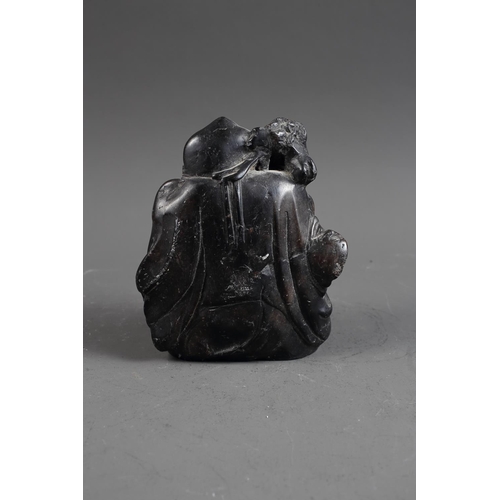 101 - A Chinese carved black hardstone figure, 6 1/4