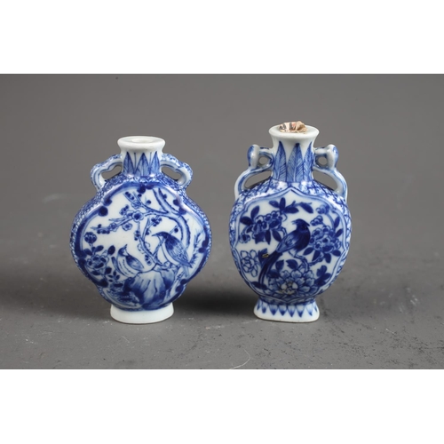 103 - Two Chinese blue and white tea bowls with panelled floral decoration and four-character, double ring... 