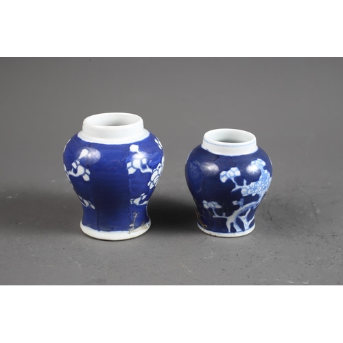 103 - Two Chinese blue and white tea bowls with panelled floral decoration and four-character, double ring... 